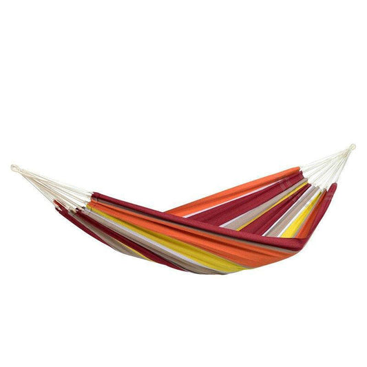 Introducing the Barbados Acerola Hammock by Amazonas, a vibrant and durable option crafted from resilient Brazilian cotton. This colorful hammock, featuring bold red, orange, yellow, and white stripes, provides an ideal setting for families seeking outdoor relaxation when suspended between two points.