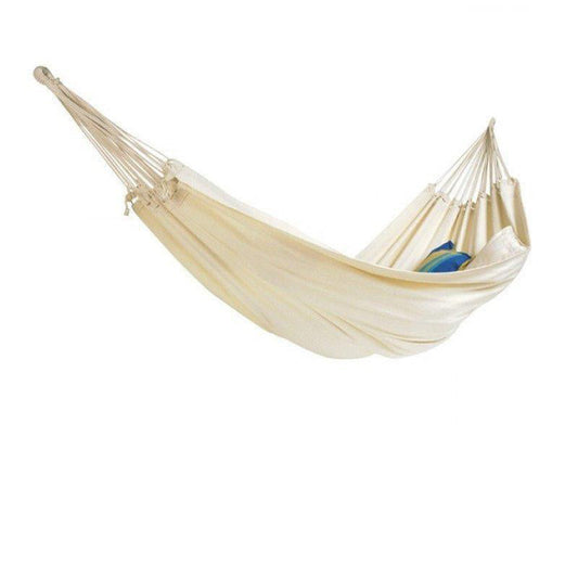 The Amazonas Barbados Natura Hammock, made from durable cream-colored Brazilian cotton, features a blue pillow inside. Its gathered ends and rope suspensions offer a cozy space for relaxation against a plain white background.