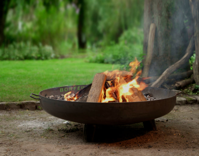 BonFeu BonBowl Plus-Fire Bowl-Bonfeu-BonBowl Plus The BonBowl Plus is a fire bowl from BonFeu. Equipped with handy legs and handles, the fire bowl is easy to move and put away on any surface. Available in 3 diameters, you have plenty of choice for the perfect fire bowl that matches your garden. Because of its timeless design, the BonBowl fits perfectly in both the modern and classic garden. With the decorative cut-out logo, the fire bowl distinguishes itself from all other fire bowls. The raised rim prevent