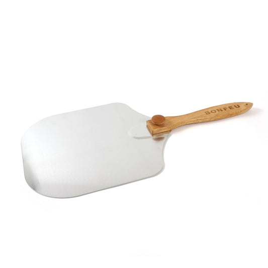 The BonFeu BonPizza Spatula, featuring a stainless steel peel and a wooden handle with a small knob for comfortable gripping, is showcased on a plain white background.