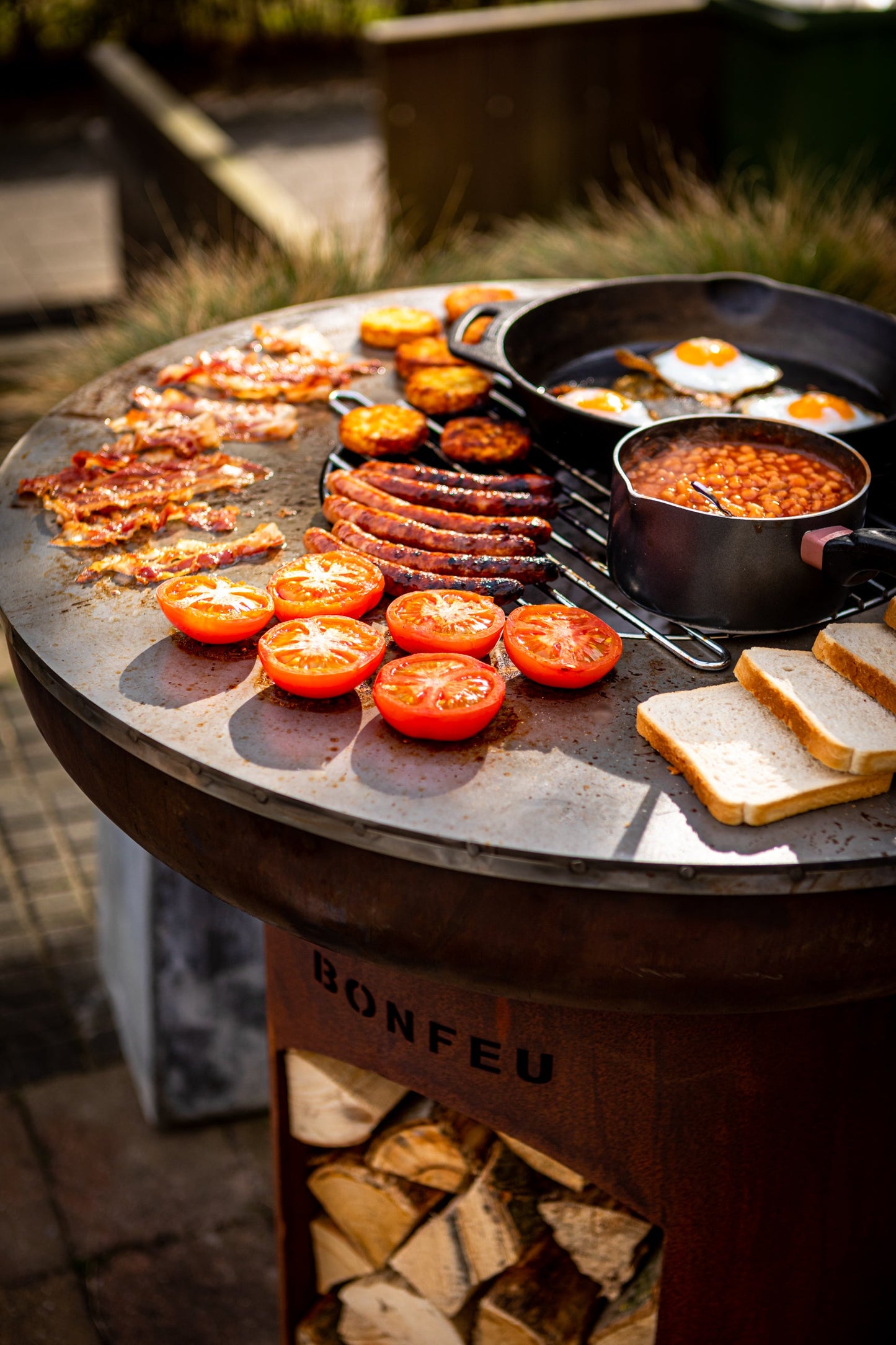 Bonfeu BonBiza Open.-Fire Bowl-Bonfeu-The BonBiza Open is an outdoor cooking instrument from BonFeu. It is like a large barbecue but for plancha baking. The BonBiza Open is one of our newer products and the showpiece of our entire collection. It is also by far the biggest product of the entire BonFeu collection. Unlike the regular BonBiza, the BonBiza Open has convenient wood storage in its base. So the BonBiza Open is the perfect piece to let you cook while enjoying a warm fire. The BonBiza Open Rust is ma