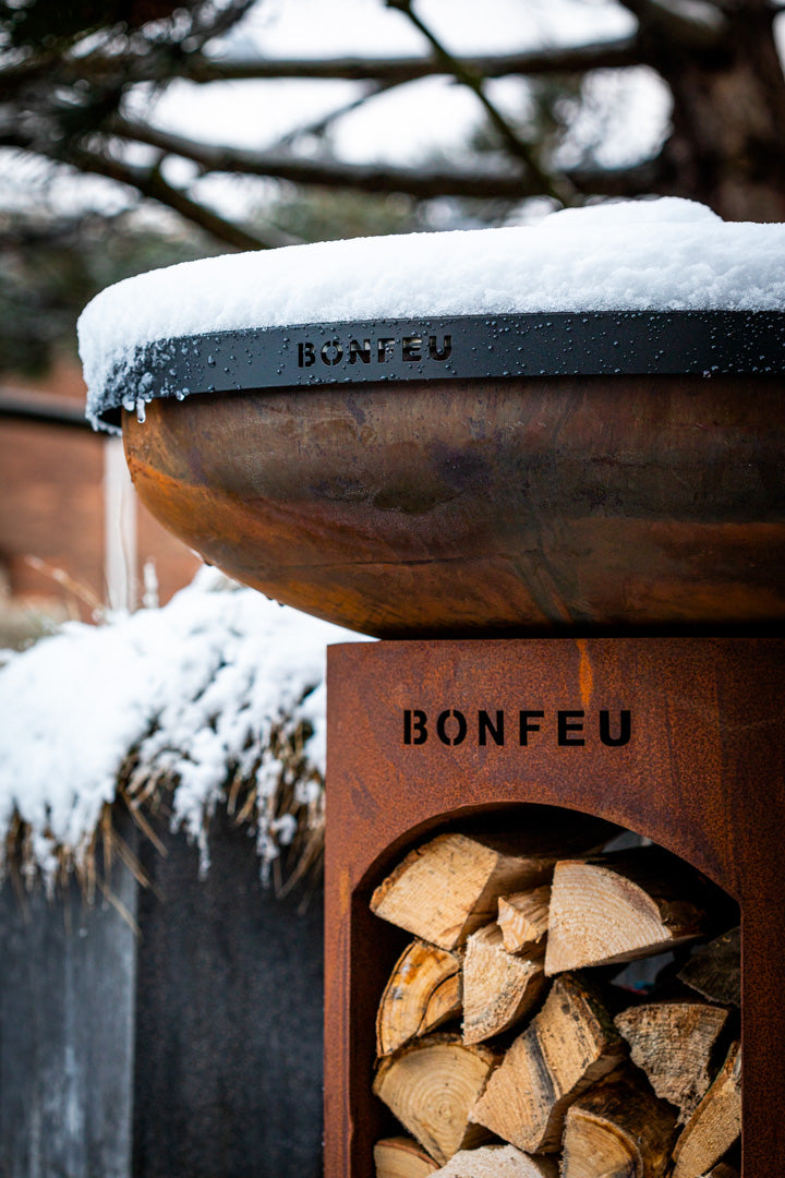 Bonfeu BonBiza Open.-Fire Bowl-Bonfeu-The BonBiza Open is an outdoor cooking instrument from BonFeu. It is like a large barbecue but for plancha baking. The BonBiza Open is one of our newer products and the showpiece of our entire collection. It is also by far the biggest product of the entire BonFeu collection. Unlike the regular BonBiza, the BonBiza Open has convenient wood storage in its base. So the BonBiza Open is the perfect piece to let you cook while enjoying a warm fire. The BonBiza Open Rust is ma