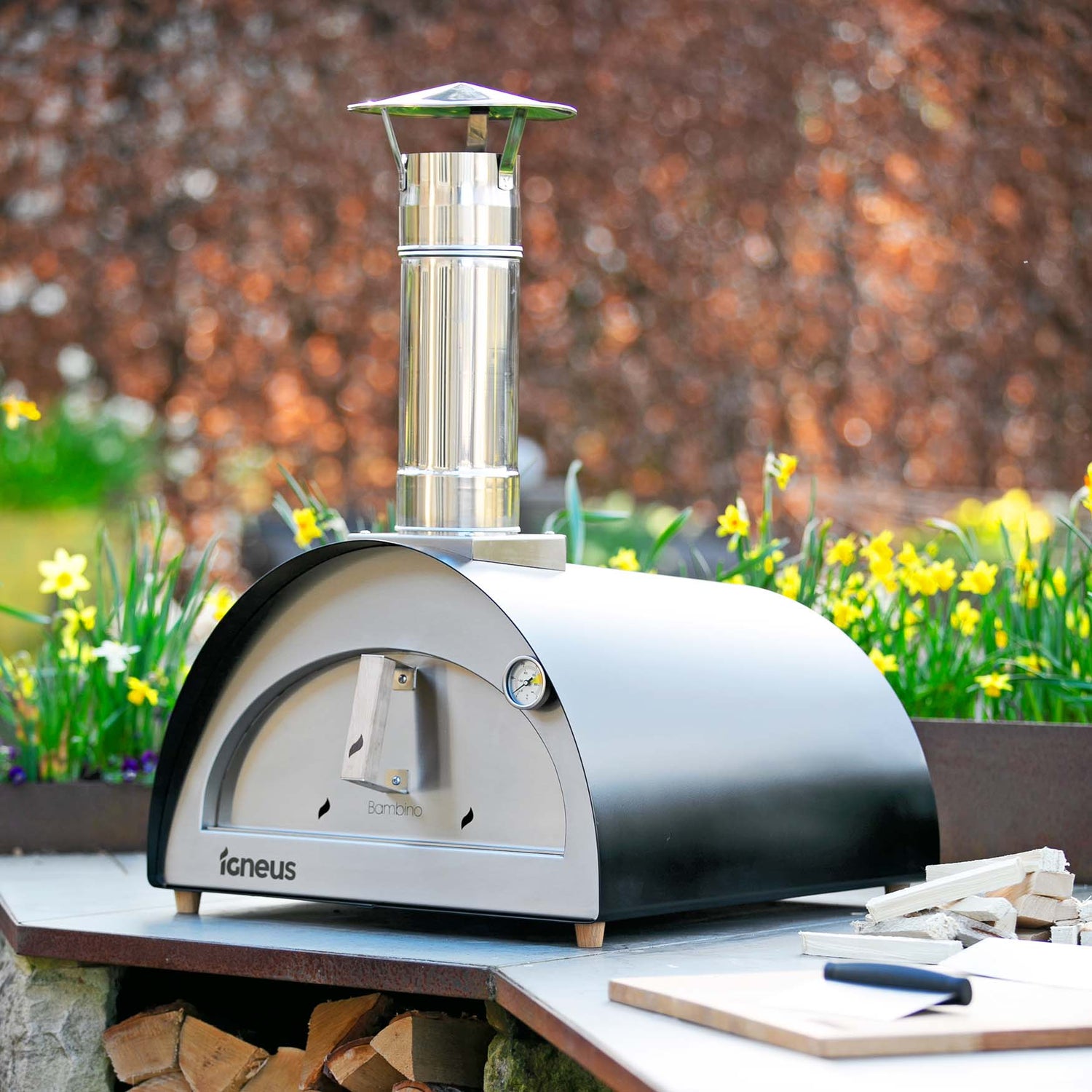 Igneus Bambino Wood Fired Pizza Oven-Pizza oven-Igneus-Igneus Bambino Wood Fired Pizza Oven Medium in size but big in function, the Igneus Bambino Pizza Oven houses a cooking area of 500x500mm. It cooks a 14" pizza in just a minute and can easily fit in a large baking tray or roasting pan. Fancy a hearty lasagna for dinner? Done. Baked potatoes on the side? Sure. This oven is designed to produce perfectly cooked meals and offer a convenient cooking process. The insulation allows for use on most surfaces tha