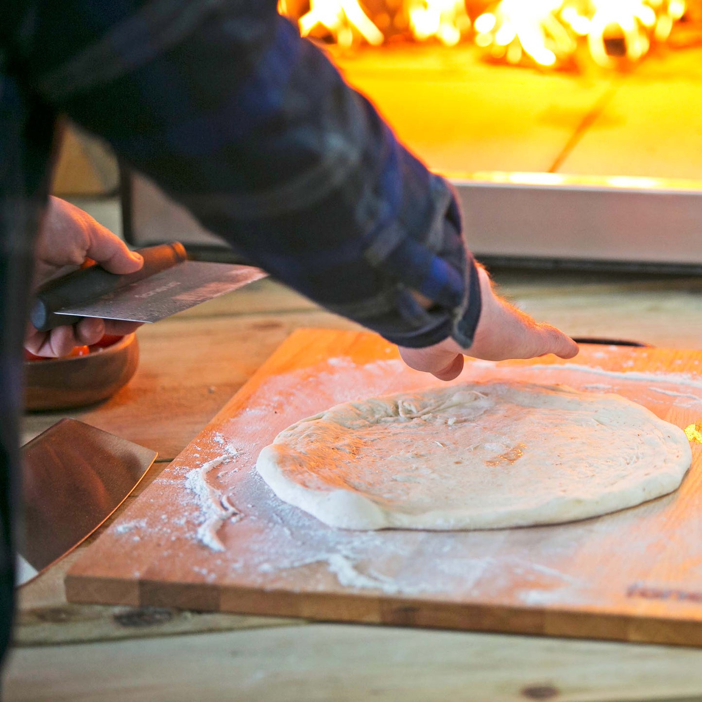 Igneus Pizza Prep Board-Pizza oven accessories-Igneus-The Igneus Pizza Oven Prep Board is constructed from premium solid oak wood, which has been treated with oil to ensure its durability and protection. Designed to facilitate the preparation of your pizza, this board allows for effortless chopping of toppings and kneading of dough. With a generous preparation surface measuring 46.5cm x 49cm, it provides ample space for all your pizza-making needs. Additionally, a metal handle is affixed to the side of the 