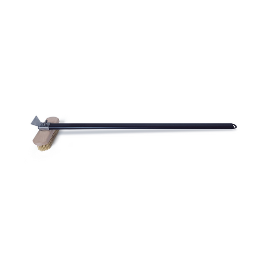 The Igneus Pro Pizza Oven Brush, designed by Igneus, comes with a long handle and a rotatable head that features brass bristles along with a metal scraper set on a wooden block. This brush is perfect for cleaning barbecues or grills. The black handle is made from durable material to ensure an easy grip.