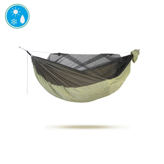 The MOSKITO-TRAVELLER QUILTED XXL by Amazonas, an extra-large camping hammock available in green and brown with thermal insulation and a built-in mosquito net, is displayed against a plain white background. In the top left corner, weather icons indicate sun, rain, and snow conditions.