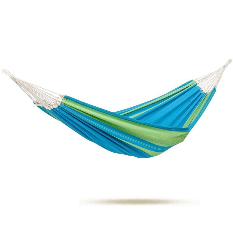 An Amazonas Santana Hammock Set, adorned in vibrant blue and green stripes, is elegantly suspended with white ropes from the robust Kronos Stand. The hammock's gentle curve reflects its Brazilian craftsmanship, indicating it is unoccupied and ready for use.