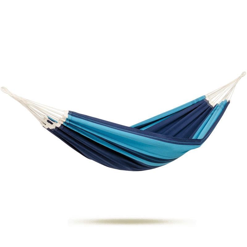 A striped blue Santana Hammock Set by Amazonas hangs gracefully against a white background. It showcases an array of blue hues, forming a captivating gradient effect. Reflecting the artisanal skill of Brazil, its ends are elegantly gathered with white cords for enhanced stability and style.